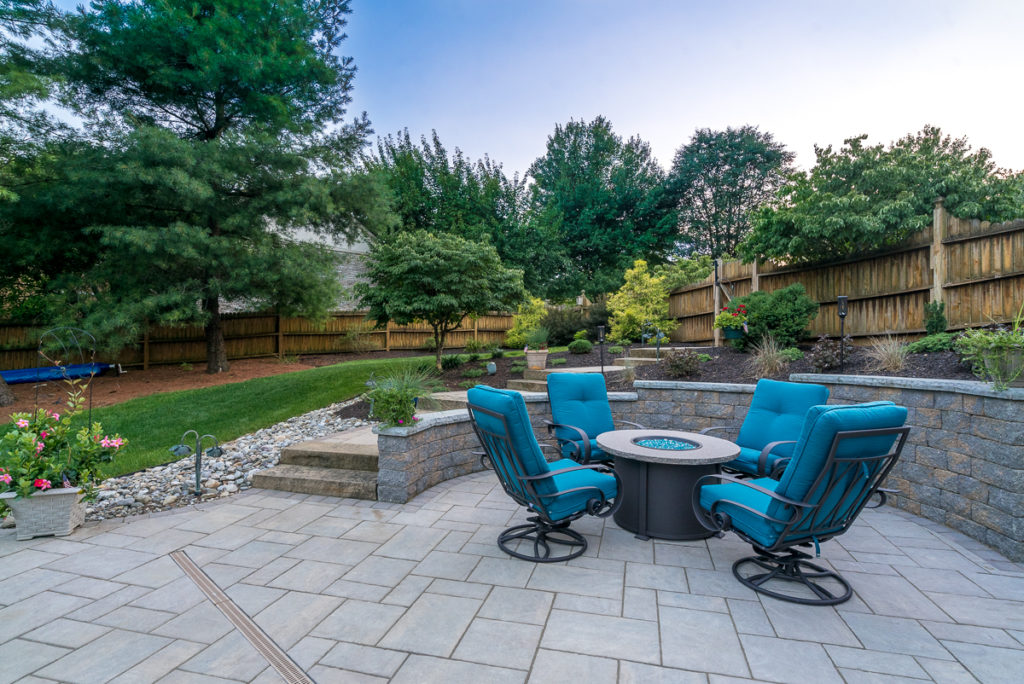blue patio furniture on outdoor stone patio