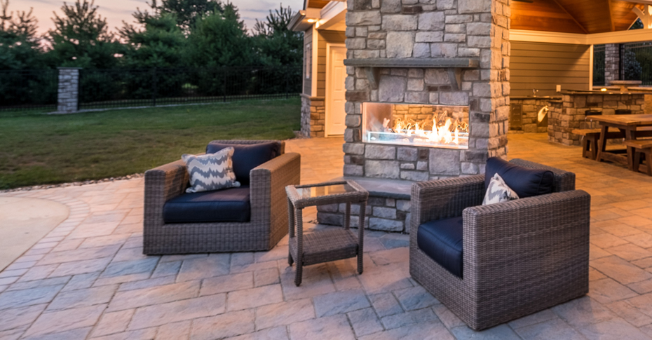 chairs by outdoor fireplace