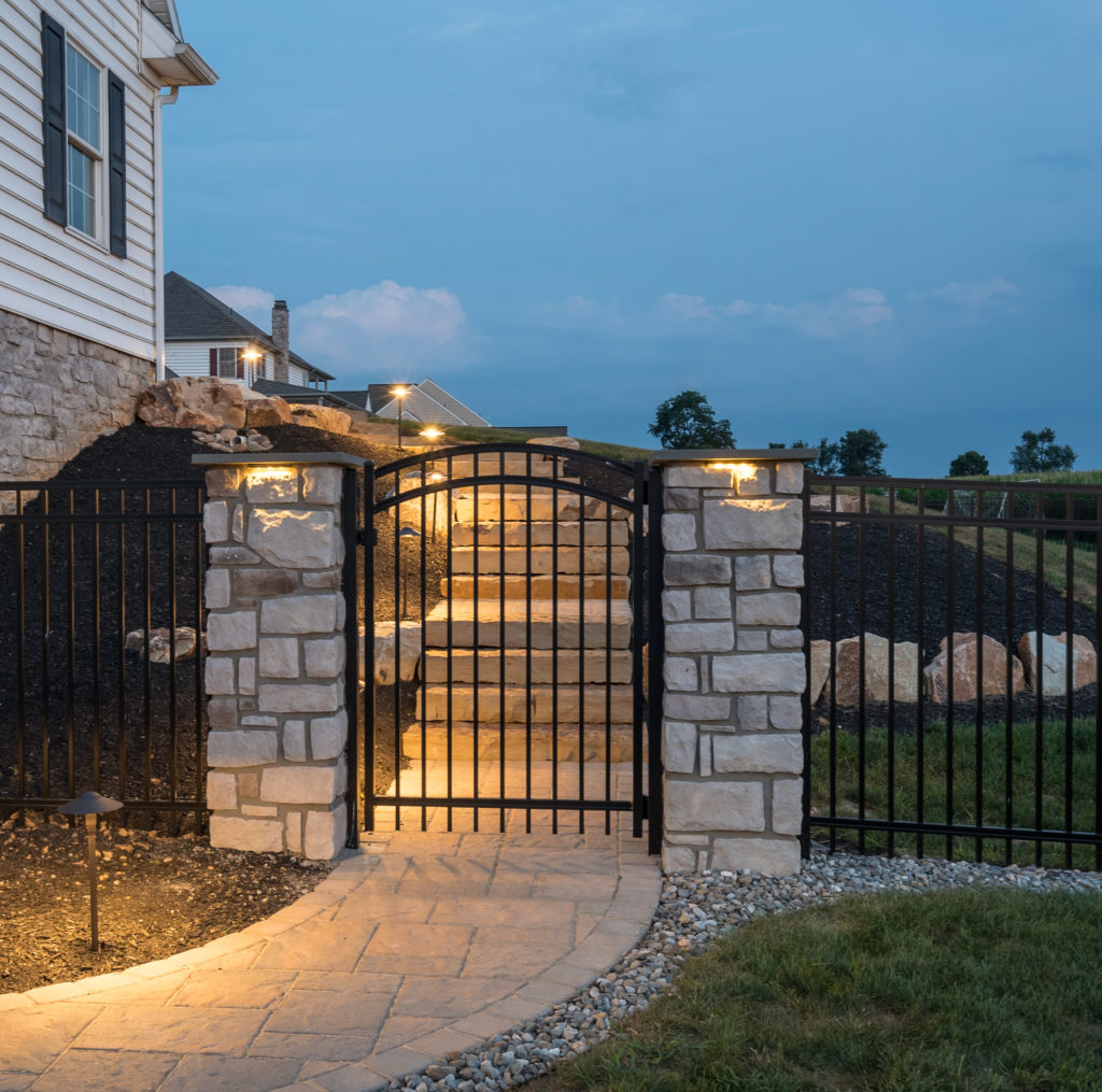 Lighted outdoor stairs with gated entrance